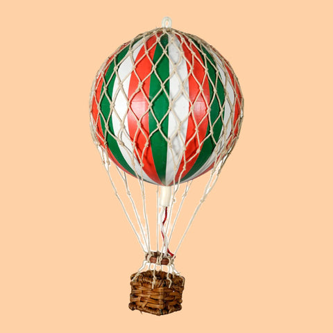 Embark on a whimsical journey through the skies aboard a Wonderen Extra Small Hot Air Balloon - Floating The Skies adorned with vibrant red, green, and white stripes from Wonderen Stroopwafels.